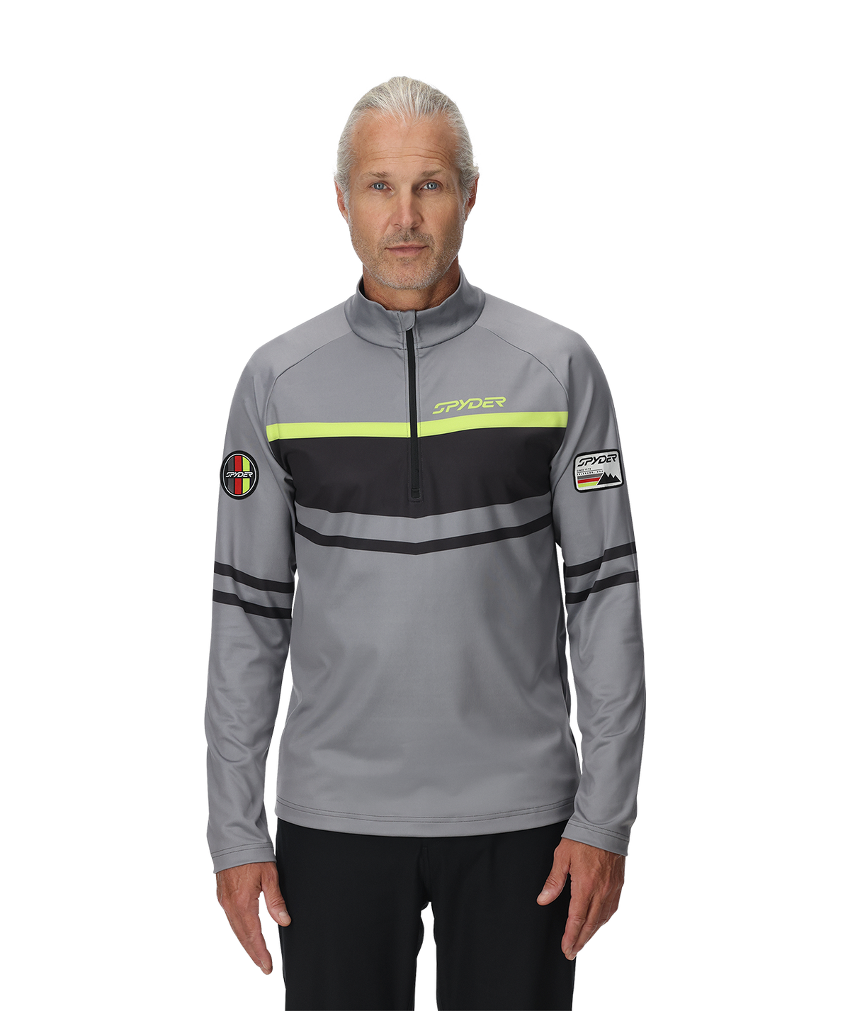 Man wearing a gray jacket with brand logos on a white background