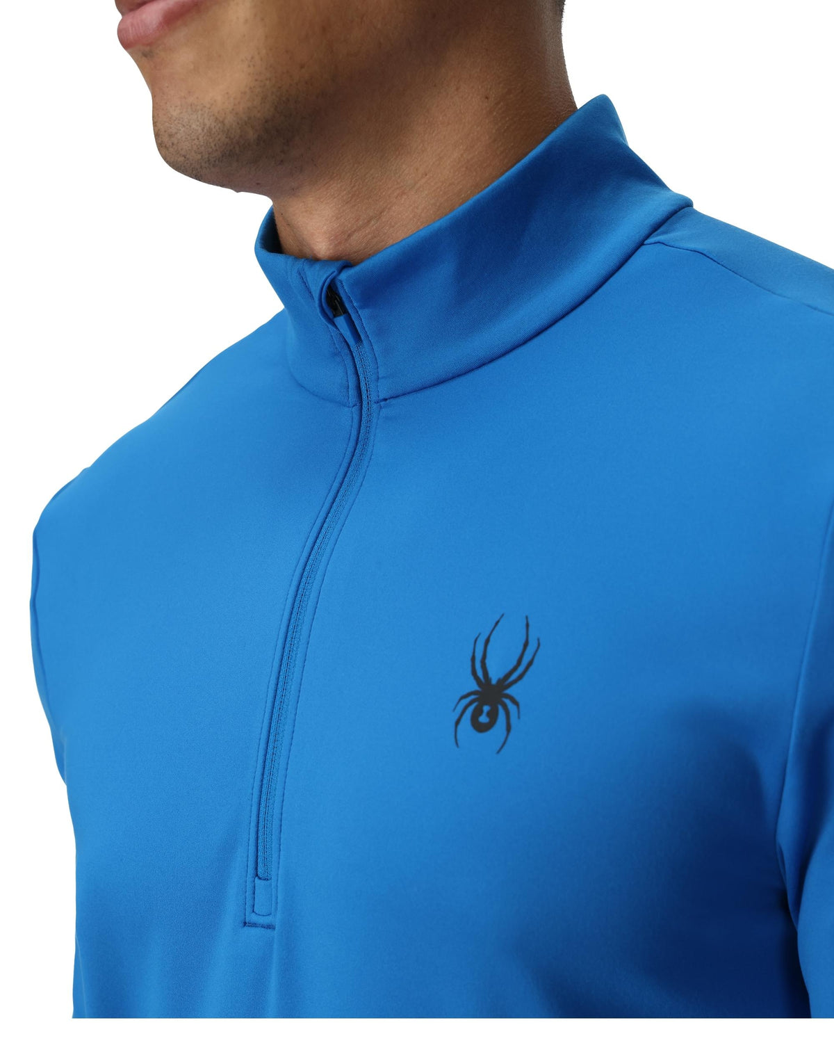 Blue athletic jacket with a spider logo on a white background