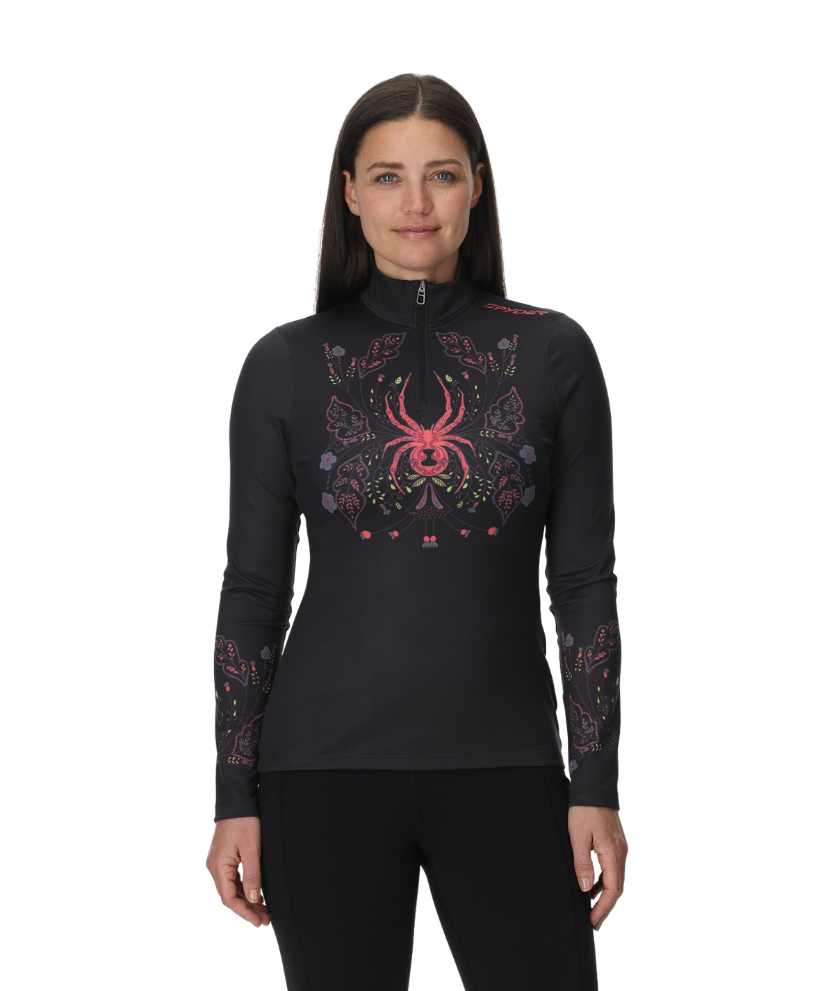 Woman wearing a black long-sleeve top with a colorful spider design on a white background