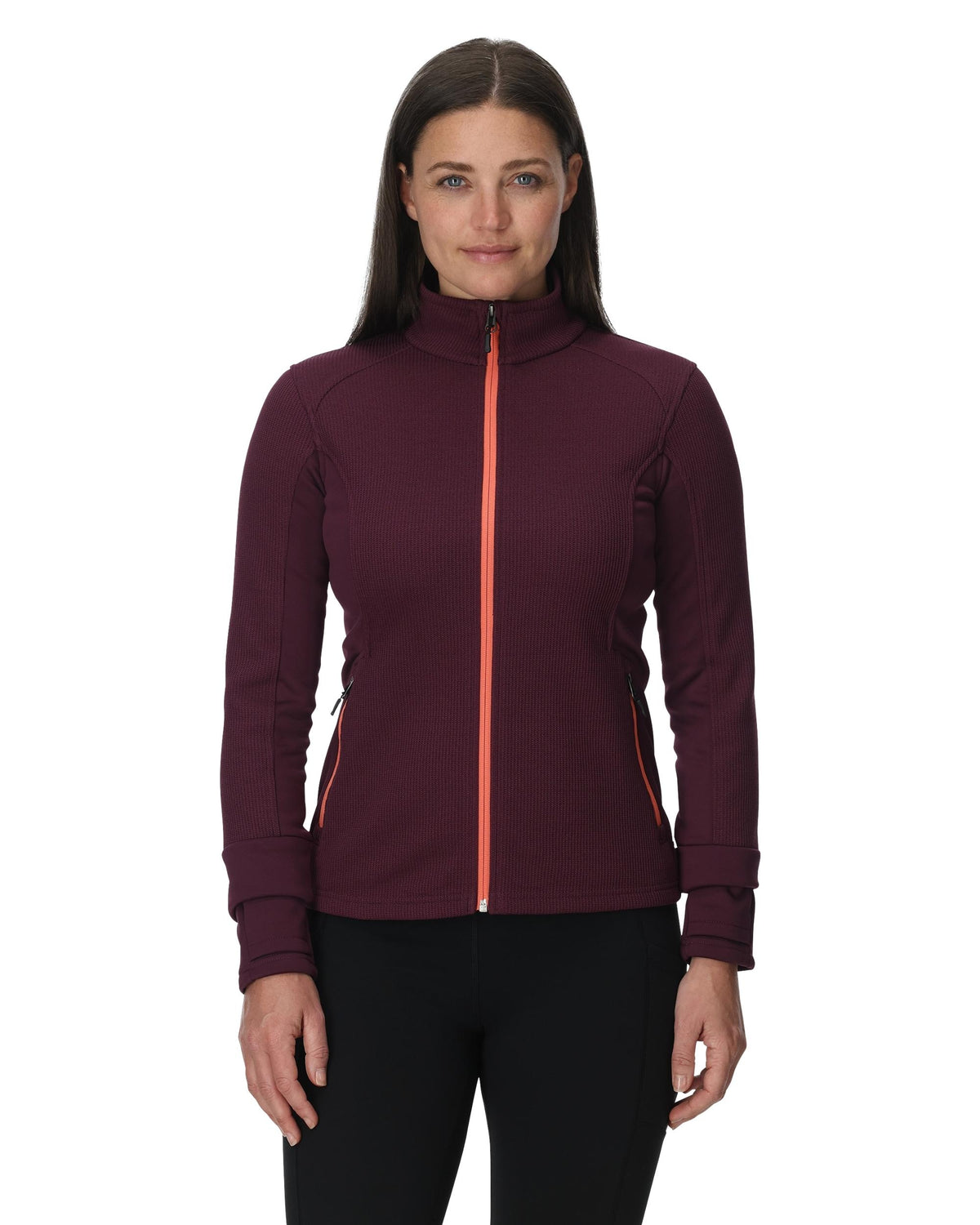 Woman wearing a maroon jacket with a red zipper on a white background