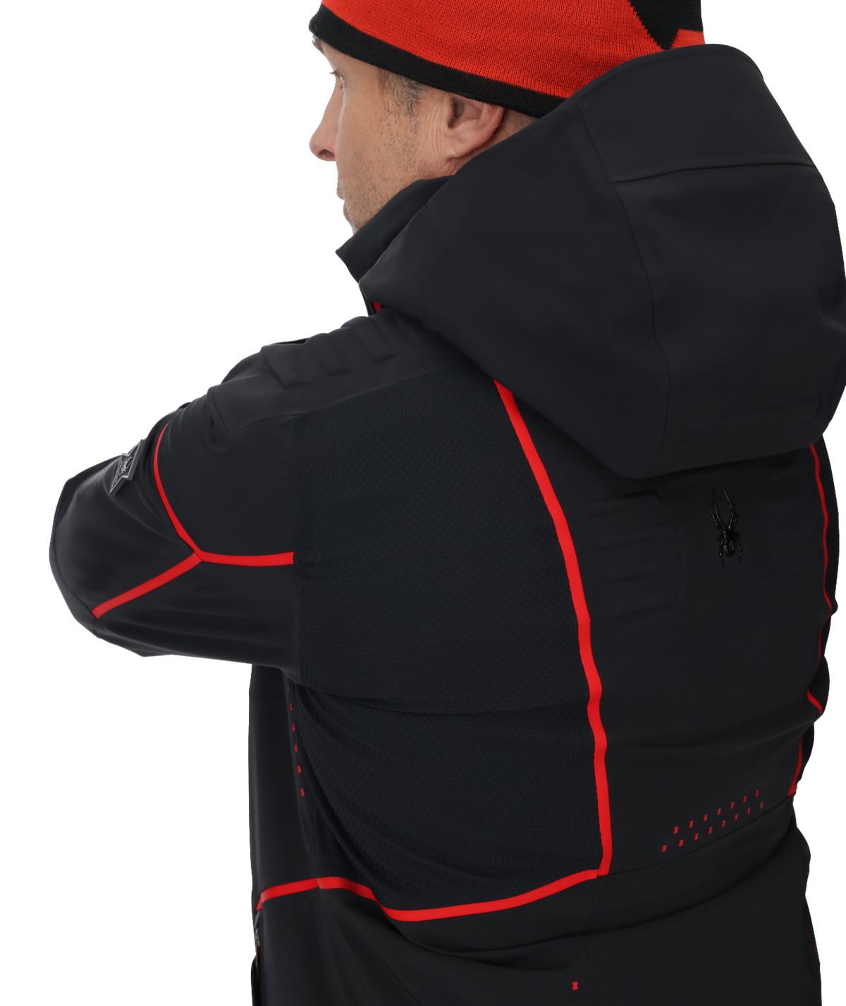 Person wearing a black jacket with red accents on a white background