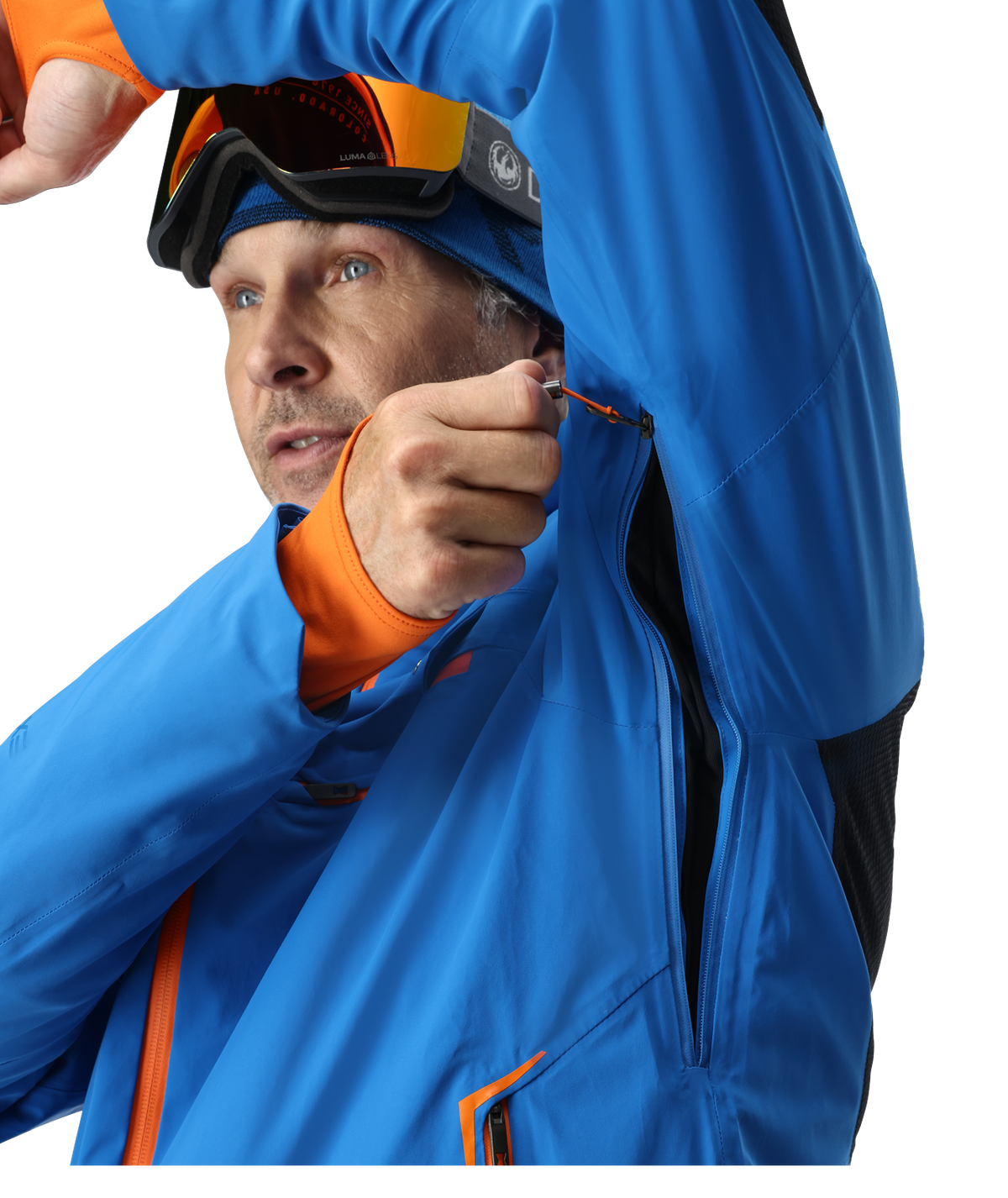 Person wearing a blue jacket with orange accents and goggles on a white background