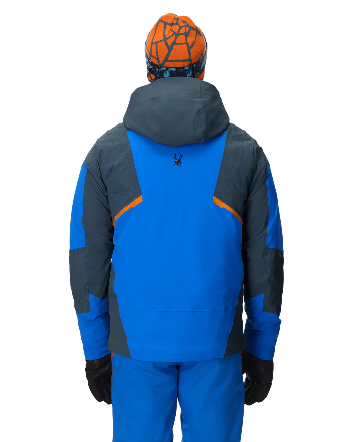Person wearing a blue and gray jacket with orange accents on a white background