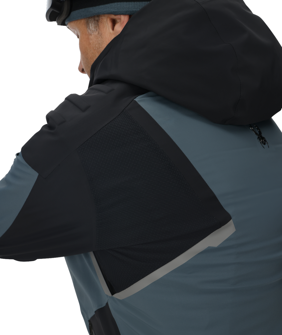 Person wearing a black and gray jacket with a hood on a white background