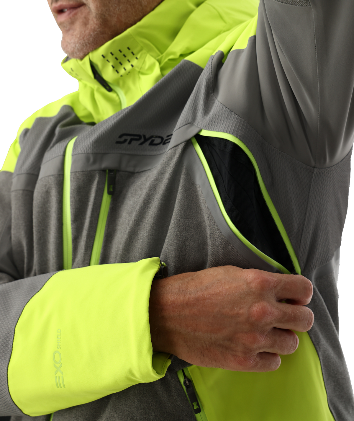 Close-up of a person wearing a gray and neon yellow Spyder jacket.