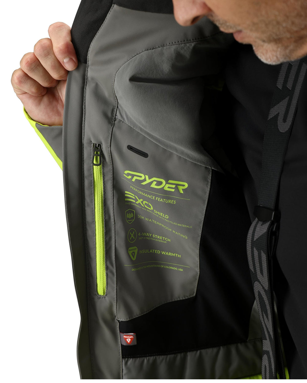 Close-up of a Spyder jacket with a focus on the brand name and design details.