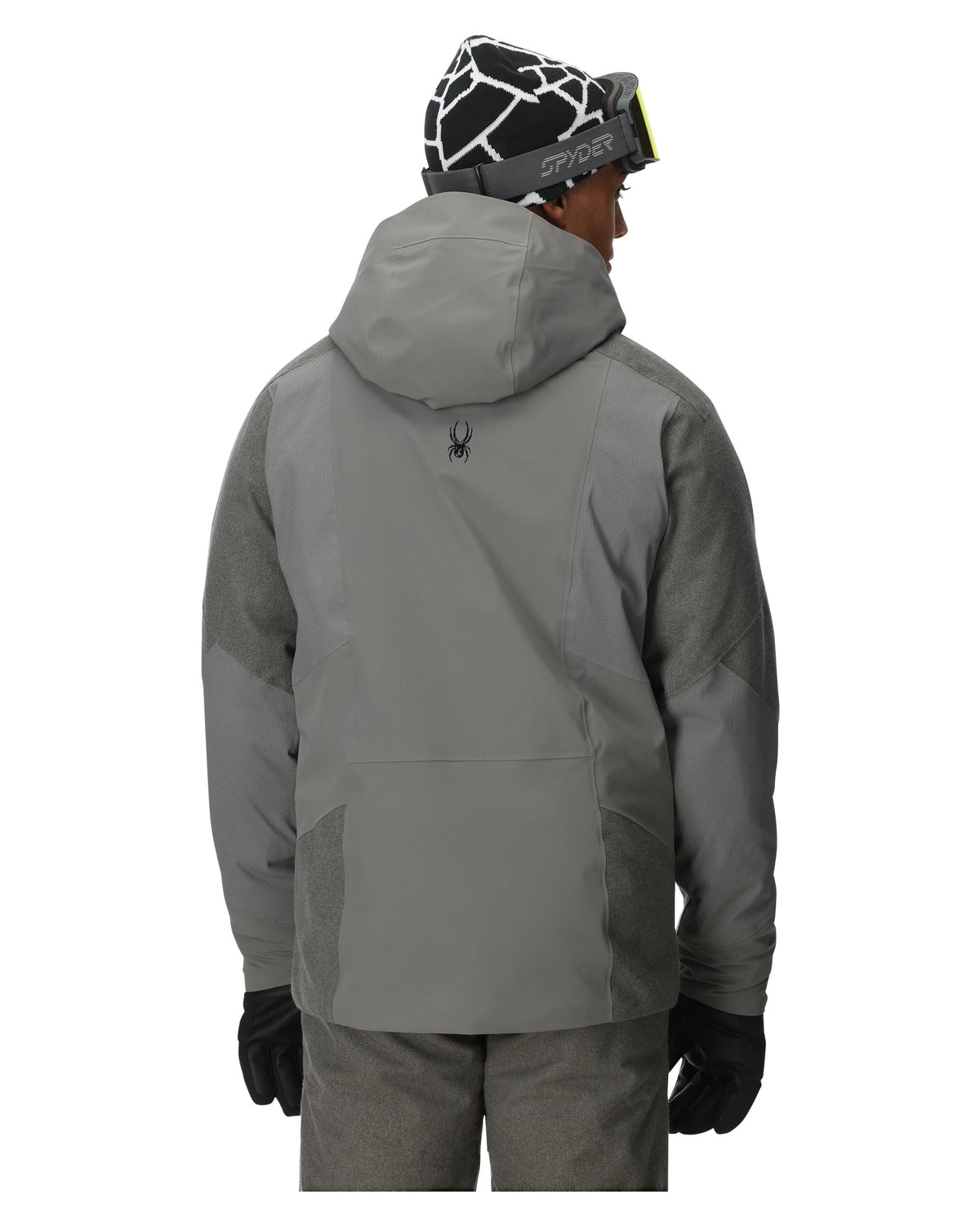 Person wearing a gray jacket and black gloves on a white background
