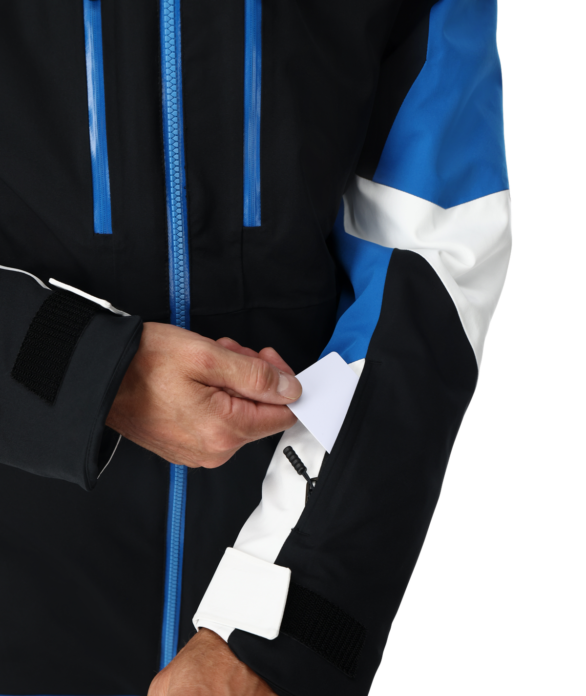 Close-up of a person wearing a black, blue, and white jacket with a focus on the zipper.
