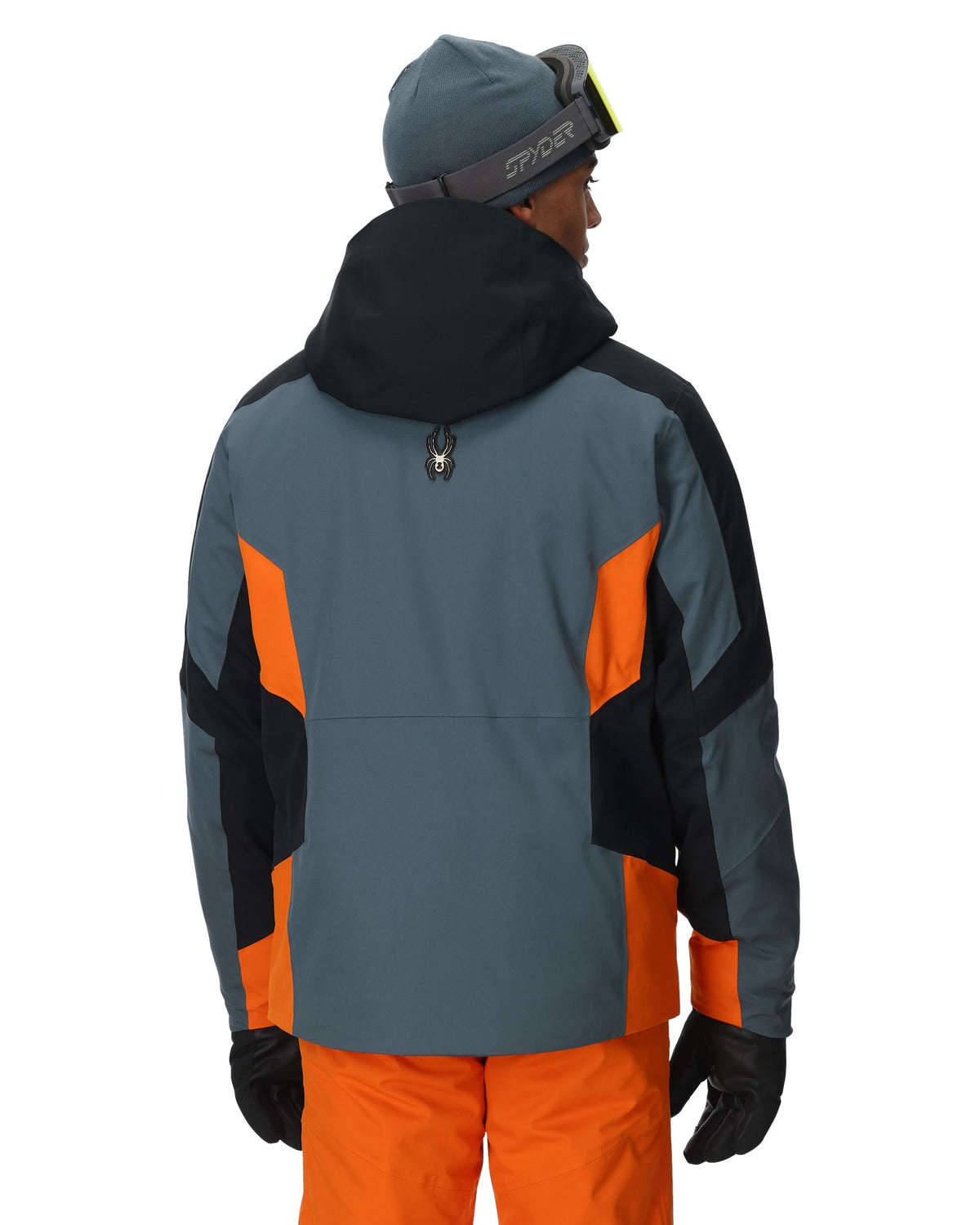 Person wearing a gray and orange jacket with black accents on a white background