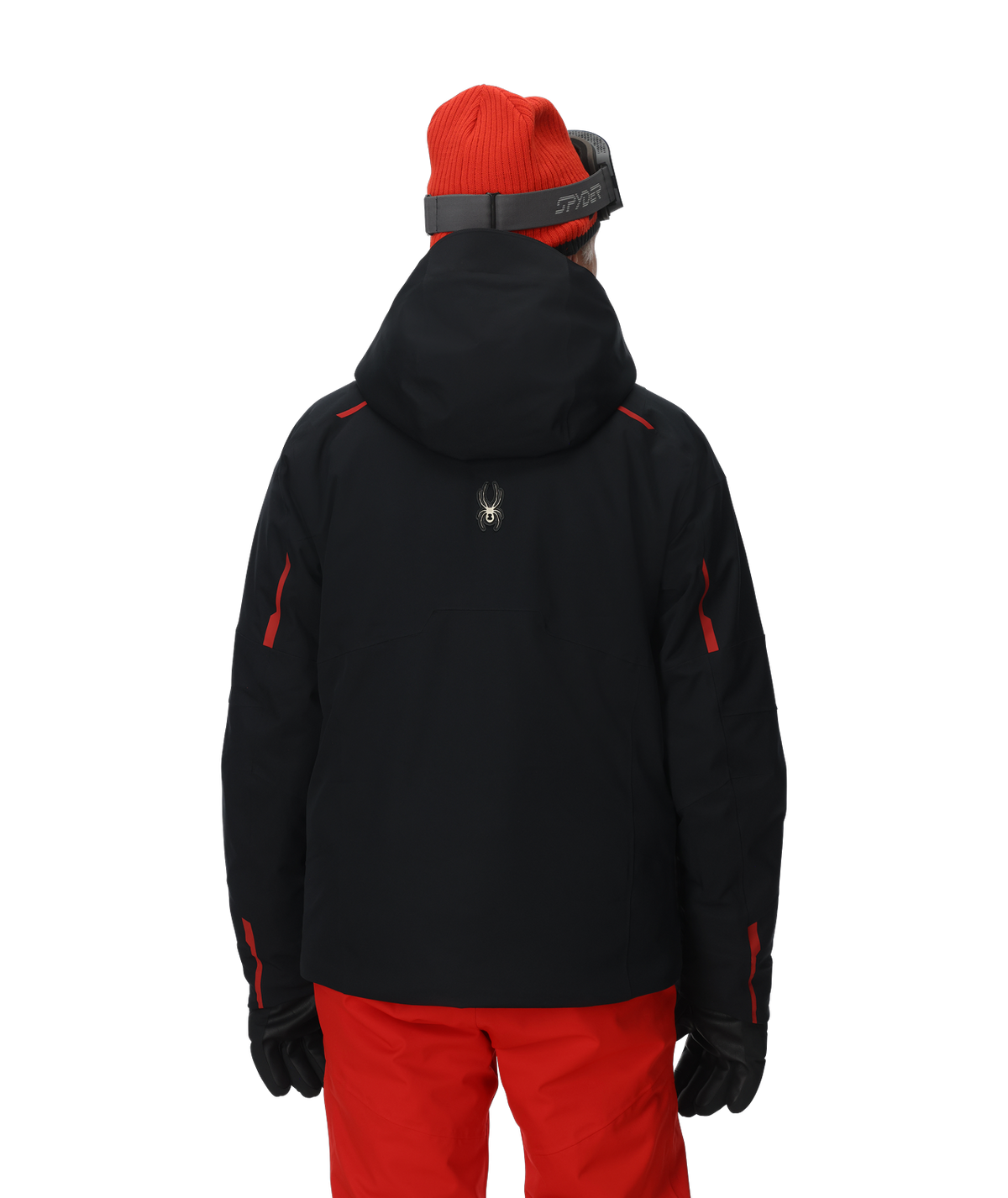 Person wearing a black jacket with red accents and red pants on a white background