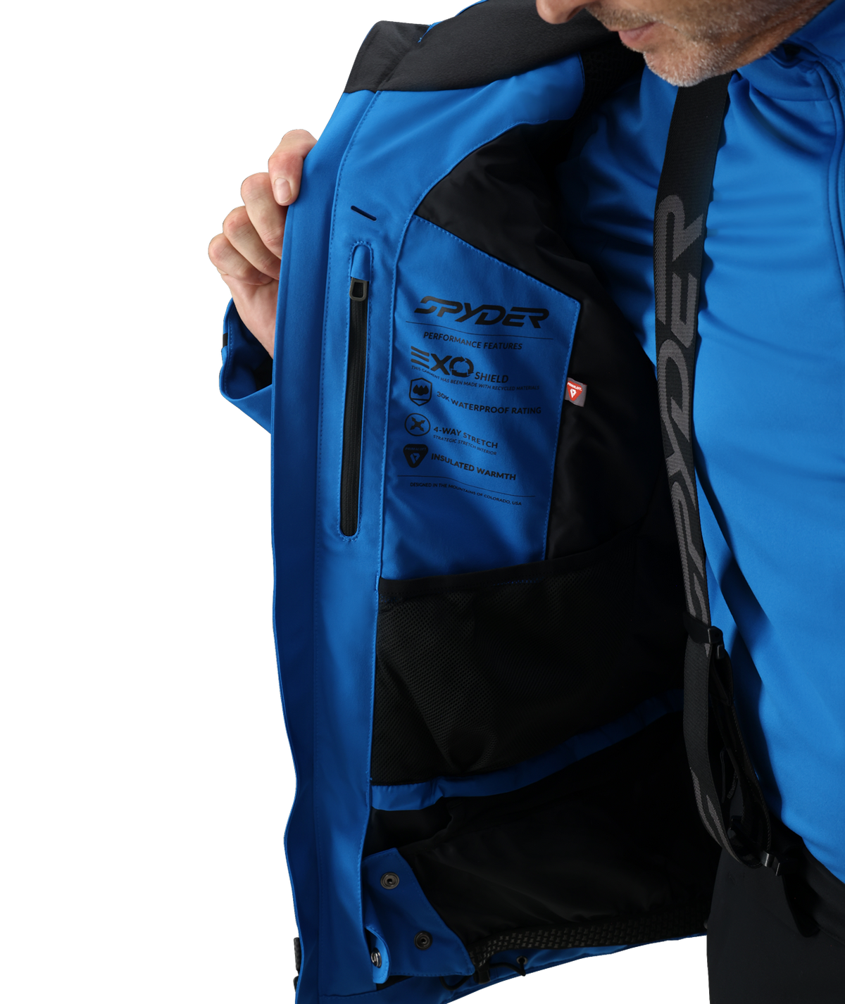 Close-up of a blue jacket with a brand logo on a white background