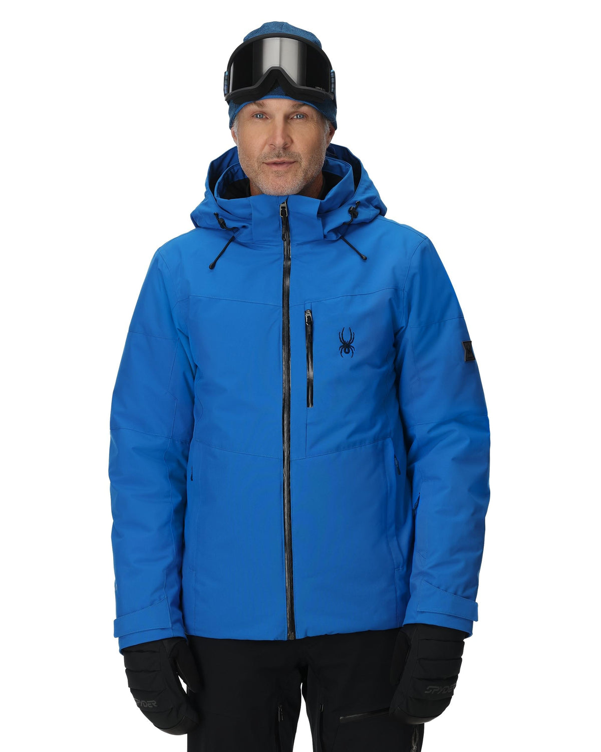 Person wearing a blue jacket with a brand logo on a white background