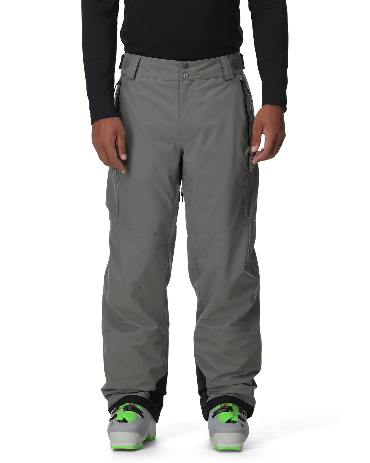Person wearing gray pants with a black top on a white background