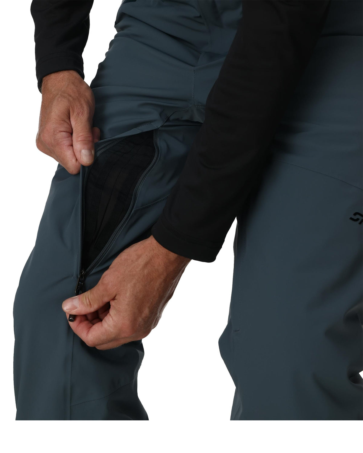 Person adjusting a dark gray jacket on a white background