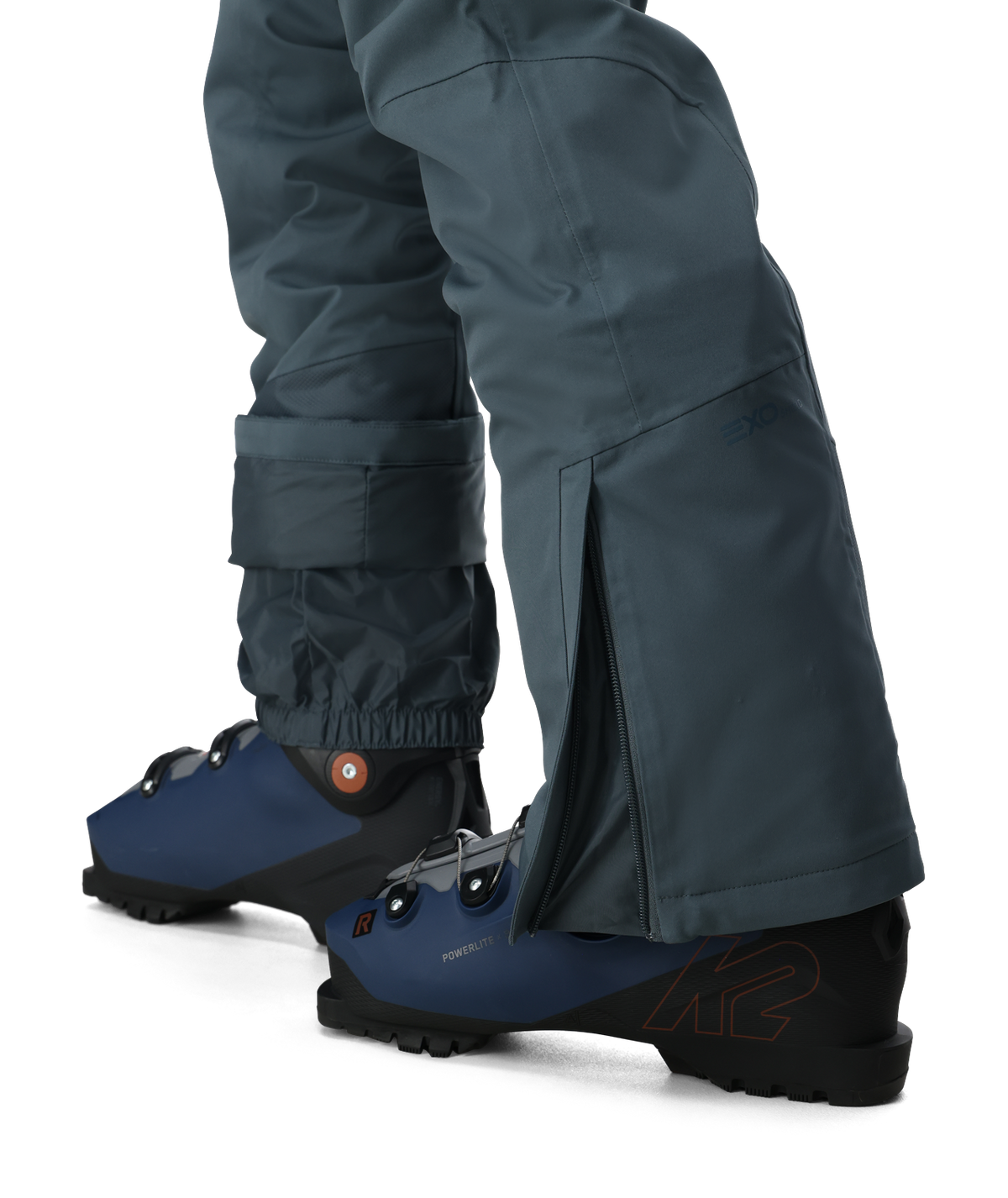 Dark gray pants with blue ankle boots on a white background