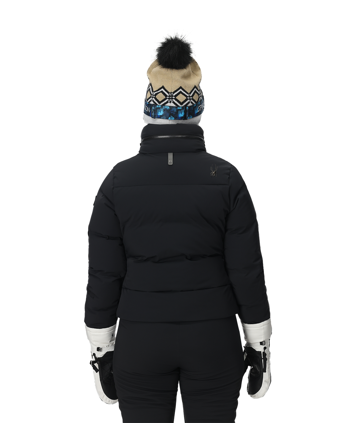 Person wearing a black puffer jacket, black pants, white gloves, and a patterned beanie on a white background