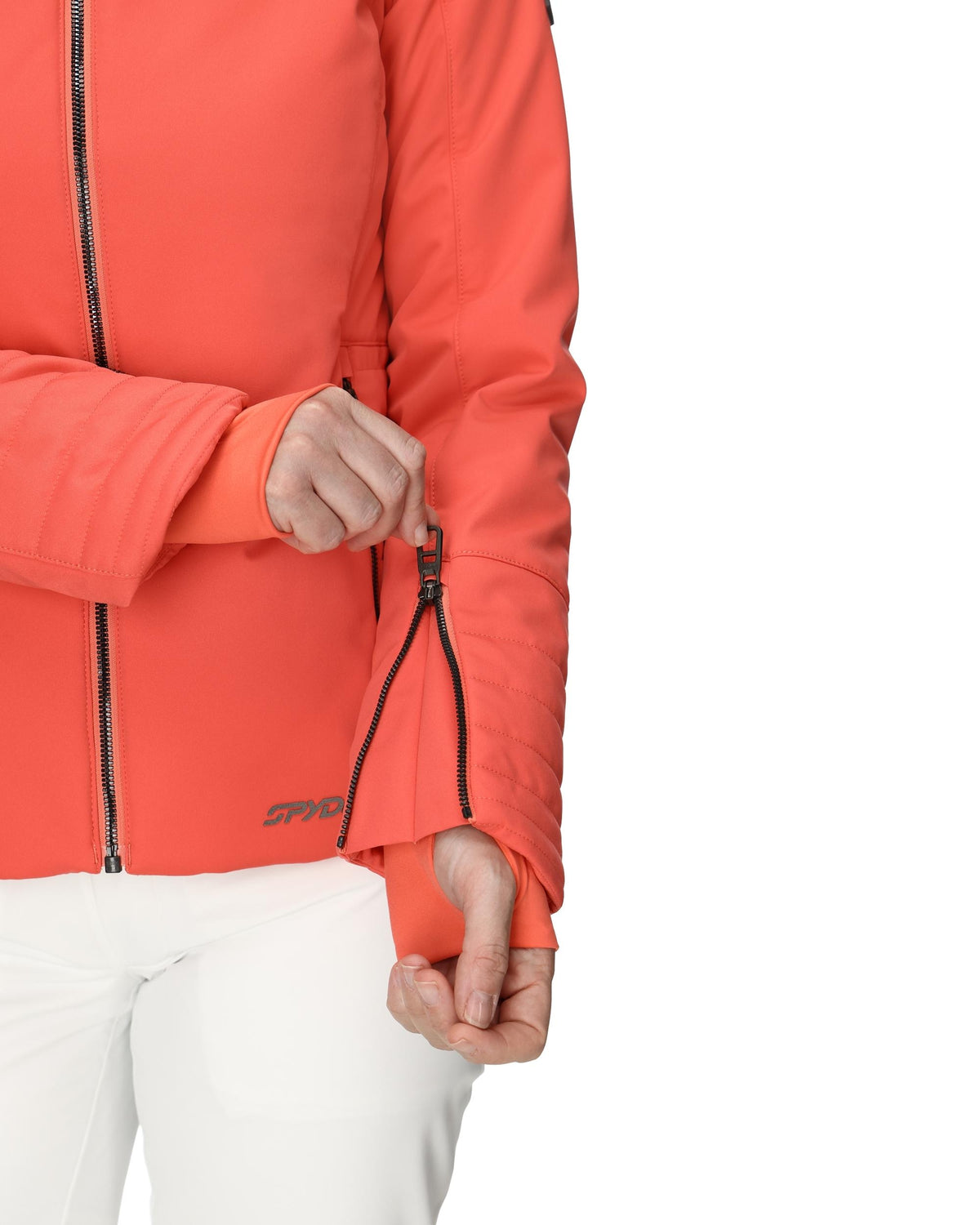 Person wearing an orange jacket with a brand logo on a white background