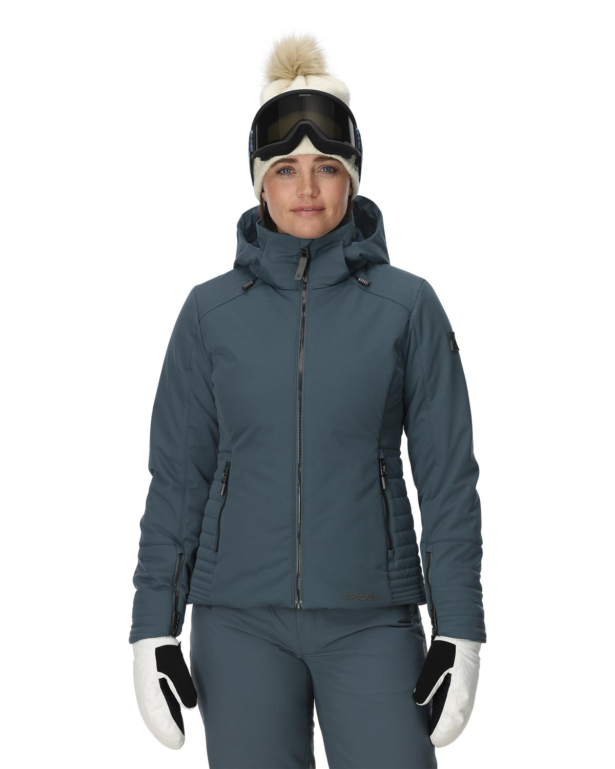 Person wearing a gray ski jacket, pants, gloves, and goggles on a white background