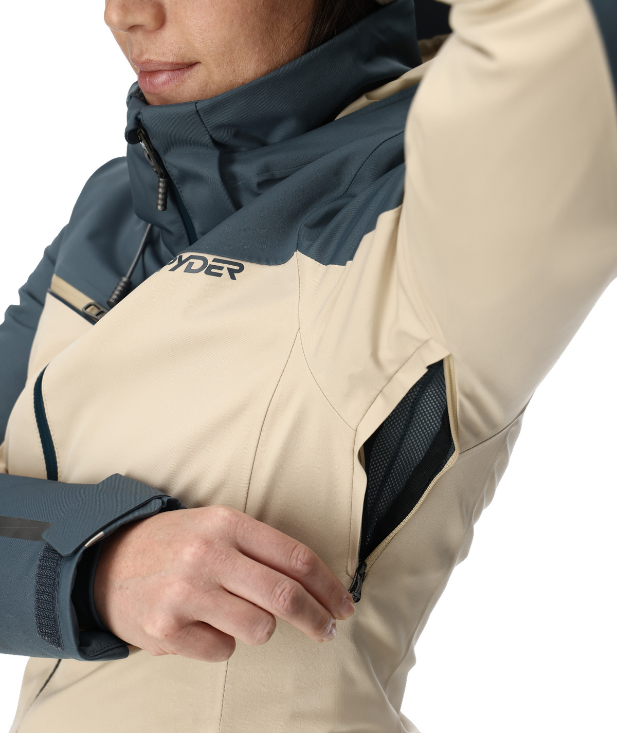 Close-up of a person wearing a two-tone jacket with a visible brand logo.