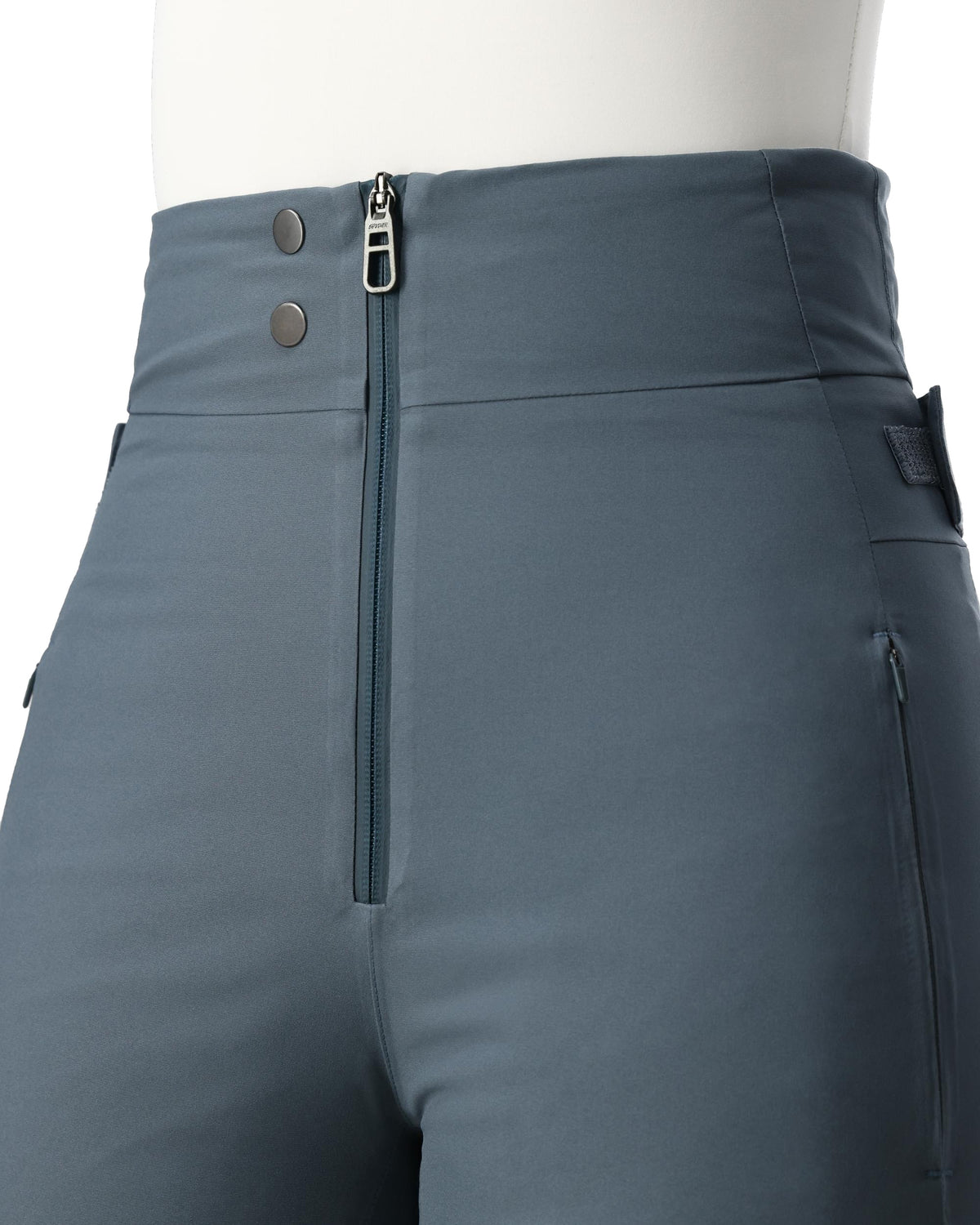 Close-up of gray pants with zippers and buttons on a white background
