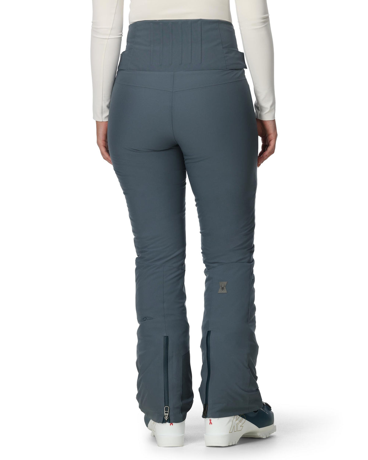 Blue pants worn by a person on a white background