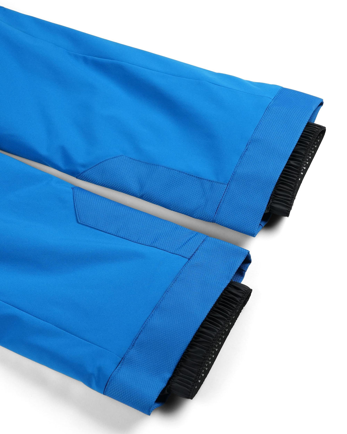 Blue fabric with black fringe on a white background