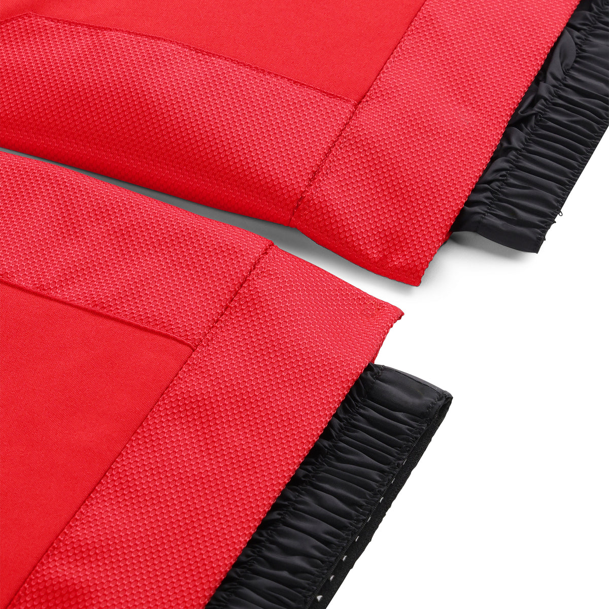 Close up of Red ski pants with adjustable suspenders and zippered hand pockets.
