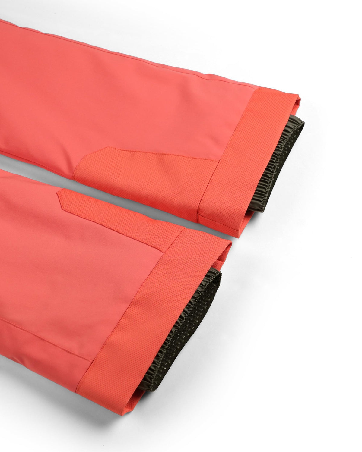 Red fabric with black trim on a white background