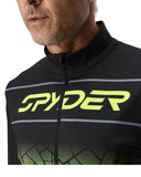Close-up of a person wearing a black Spyder cycling jacket with green logo.