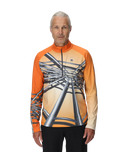 Man wearing an orange and beige long-sleeve shirt with a unique design on a white background