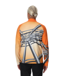Person wearing an orange and black long-sleeve shirt with a unique design on the back, on a white background.