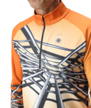 Orange and beige long-sleeve shirt with spider web design and logo on a white background