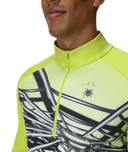 Close-up of a person wearing a bright green athletic jacket with a spider logo.