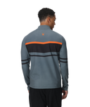 Man wearing a gray and black striped long-sleeve shirt with orange accents on a white background