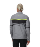 Person wearing a gray and black jacket with a logo on the back, on a white background