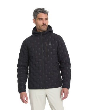 Man wearing a black quilted jacket with a pattern on a white background