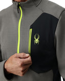 Gray and black jacket with a green zipper and logo on a white background