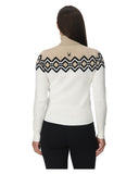 Woman wearing a white sweater with black geometric patterns on a white background
