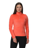 Woman wearing an orange long-sleeve athletic top on a white background