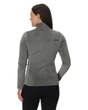 Woman wearing a gray fleece jacket with a brand logo on the back, standing against a white background.