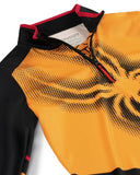 Close-up of a black and orange sports jersey with a brand label.
