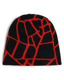 Black beanie with red geometric pattern on a white background
