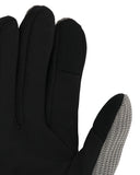Black glove with textured palm on a white background