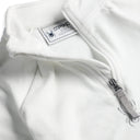 Close up of fleece quarter zip with sparkle spyder logo.