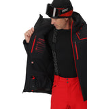 Person wearing a black and red ski jacket with goggles on a white background