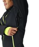 Black jacket with neon green accents on a white background