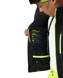 Person wearing a black and yellow jacket with Spyder branding on a white background