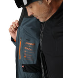 Person wearing a Spyder jacket with visible branding and product features.
