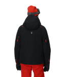 Person wearing a black jacket with red accents and red pants on a white background