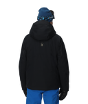 Person wearing a black jacket and blue pants with a blue beanie on a white background